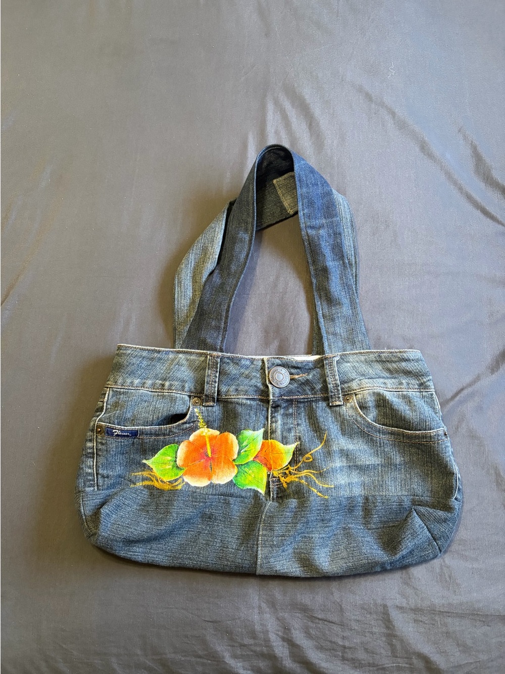 Y2K 2000s style blue denim homemade handbag w/ painted flower design.